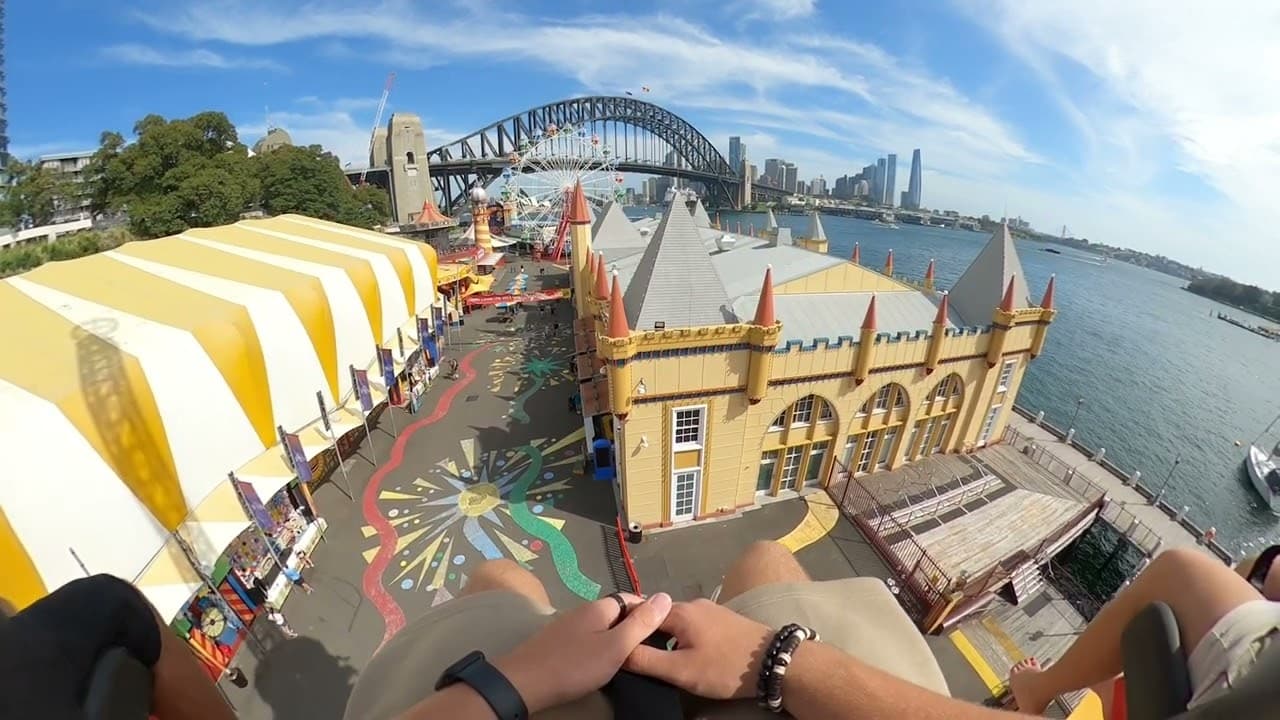The Hair Raiser drop tower lit up at night at Luna Park Sydney