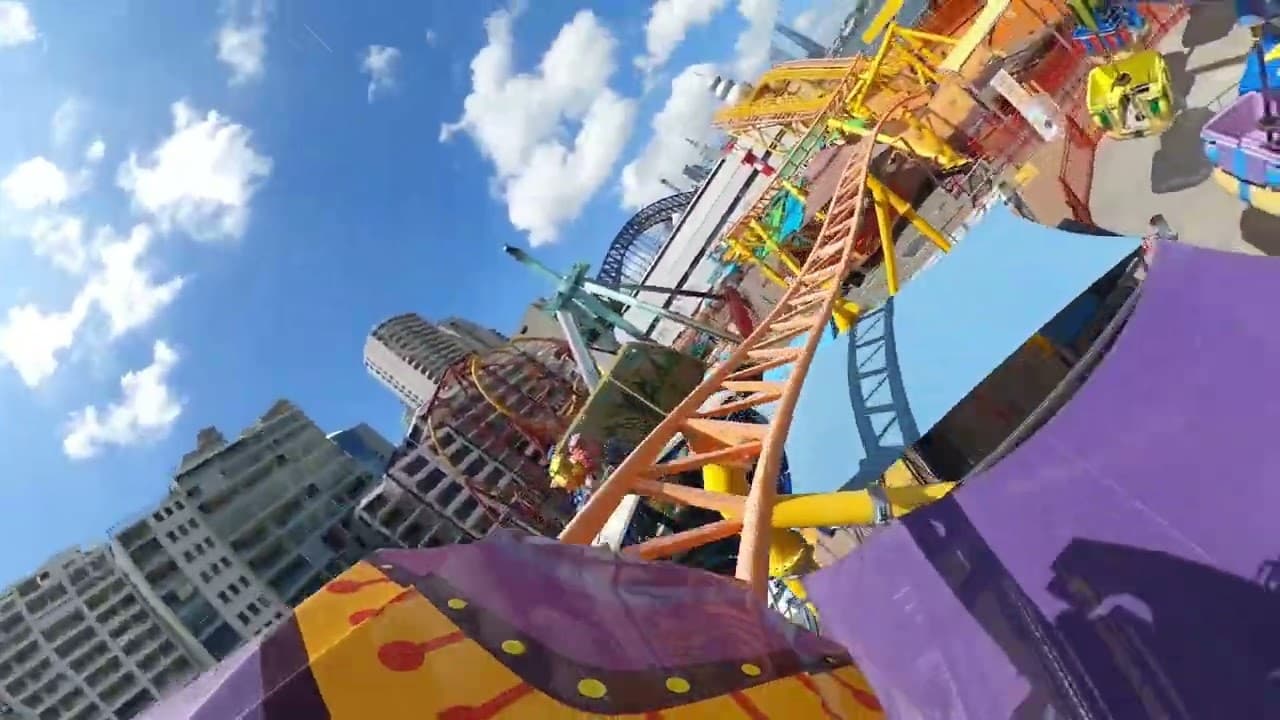 Riders on the Boomerang family roller coaster at Luna Park Sydney
